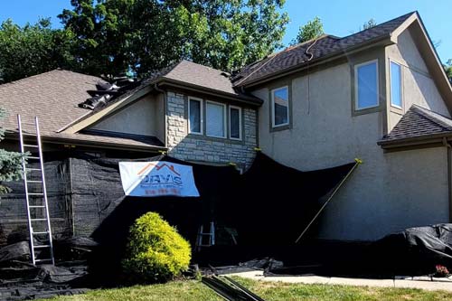 Roof being repaired on a home
