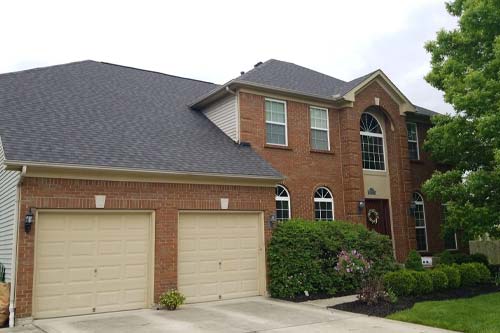 Red brick home front lawn view