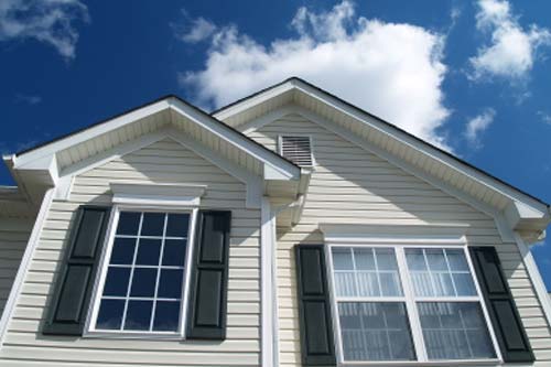 Front view of home with white vinyl siding